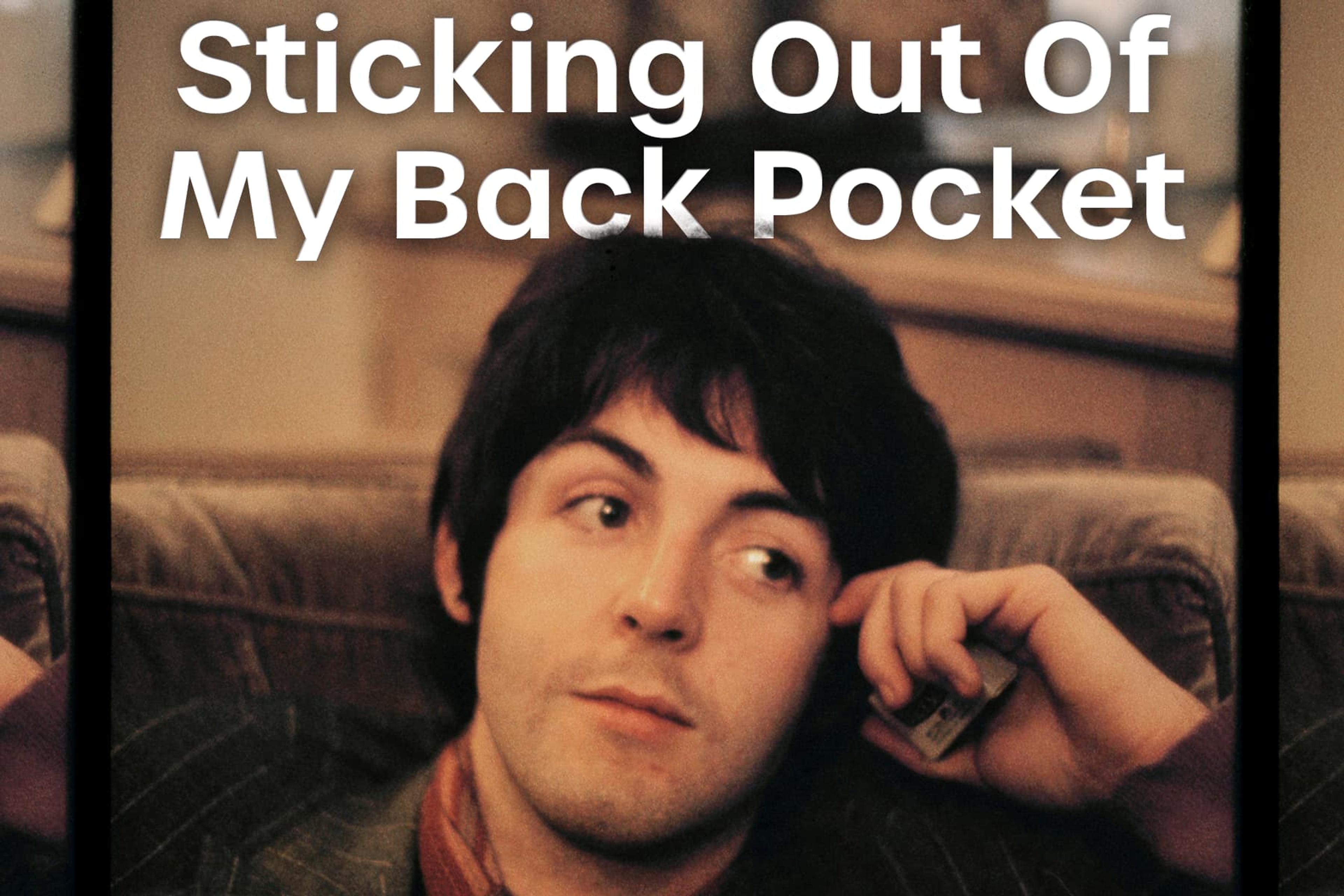 Photo of Paul McCartney taken by Linda McCartney with the logo for the monthly Spotify playlist 'Sticking Out Of My Back Pocket'