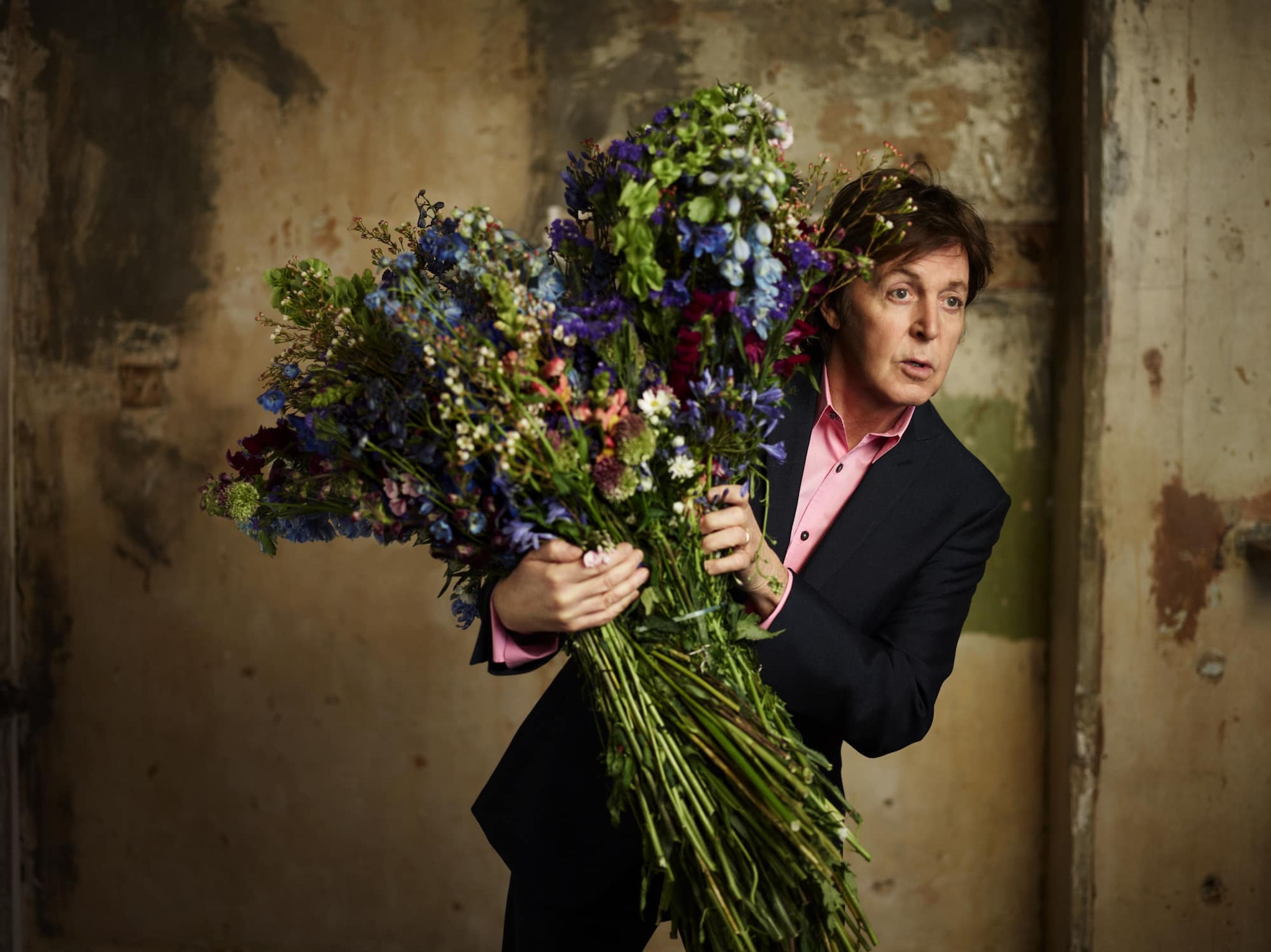 Photo of Paul holding flowers used to promote 'Kisses on the Bottom' 