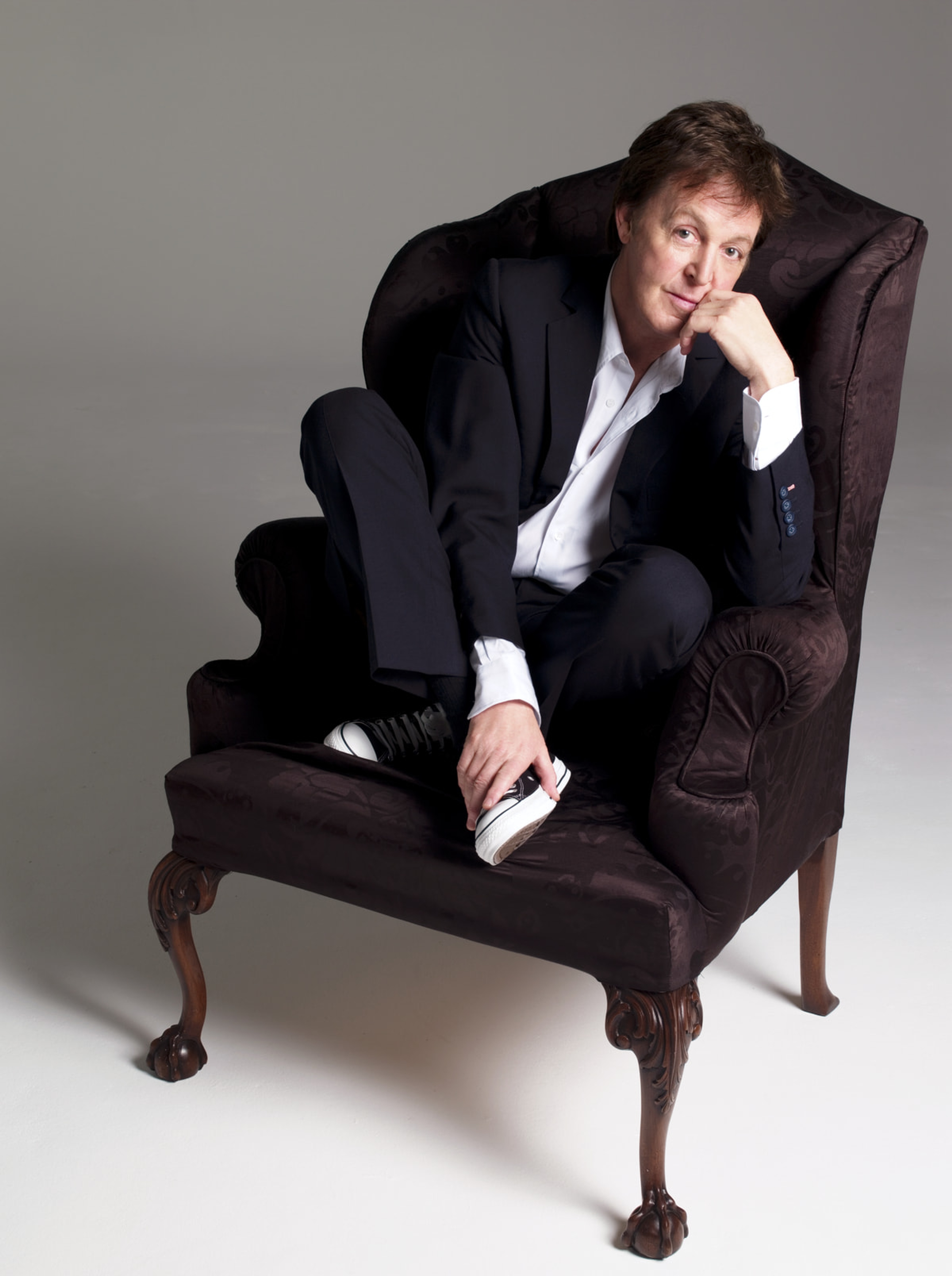 Paul sat on an armchair