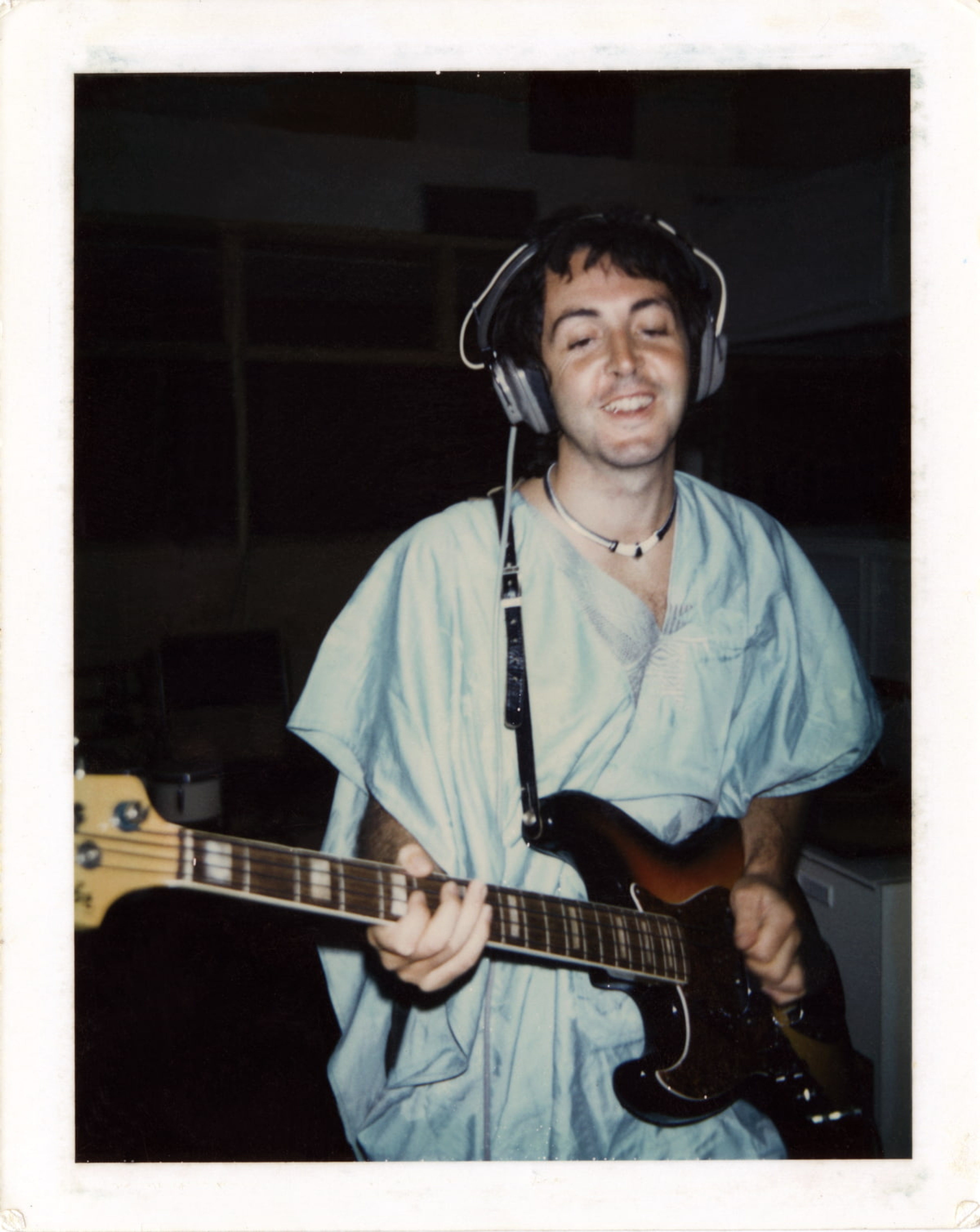 Polaroid photo of Paul playing guitar in the studio