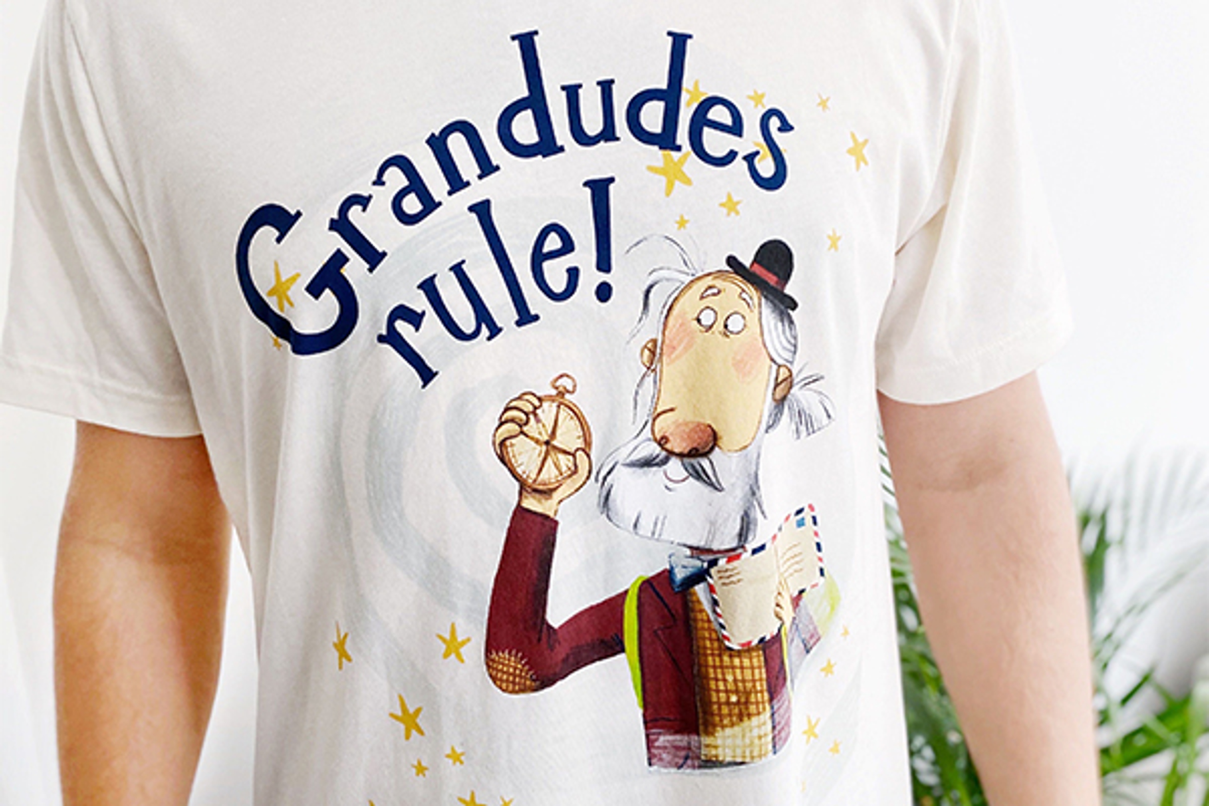 A man wearing a t shirt with a Hey Grandude! logo design