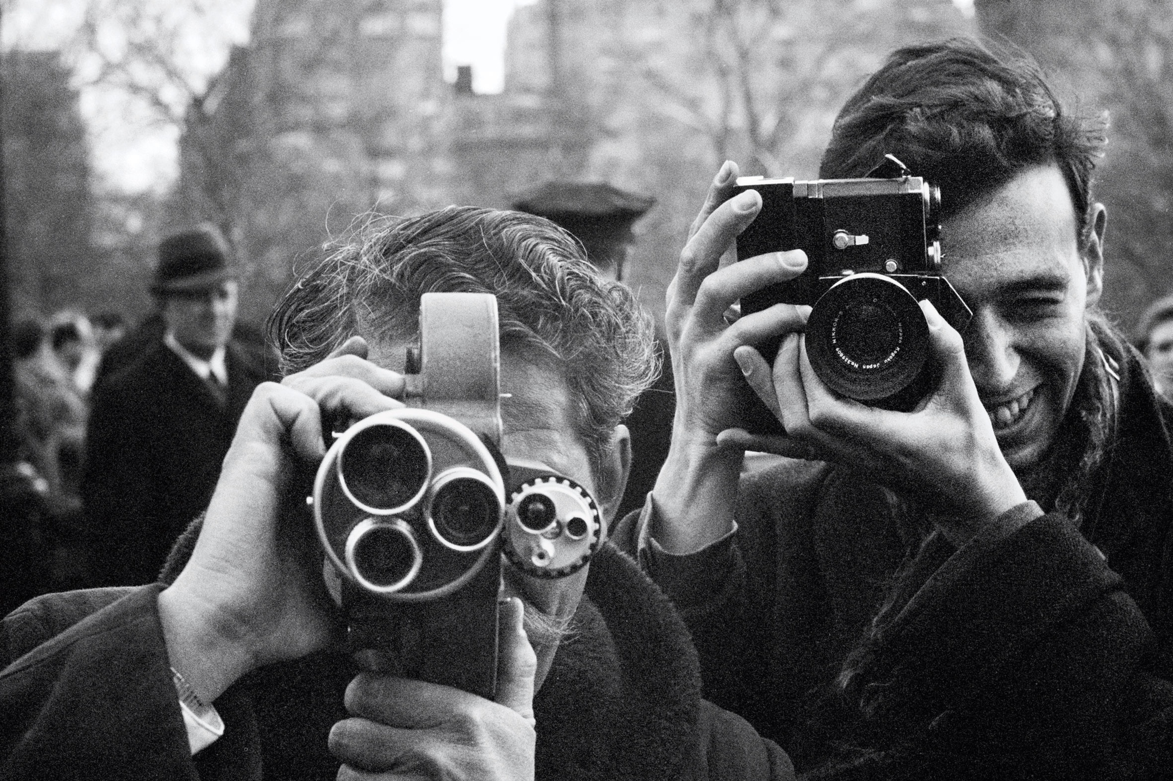 Black and white photograph of paparazzi in Central Park in New York
