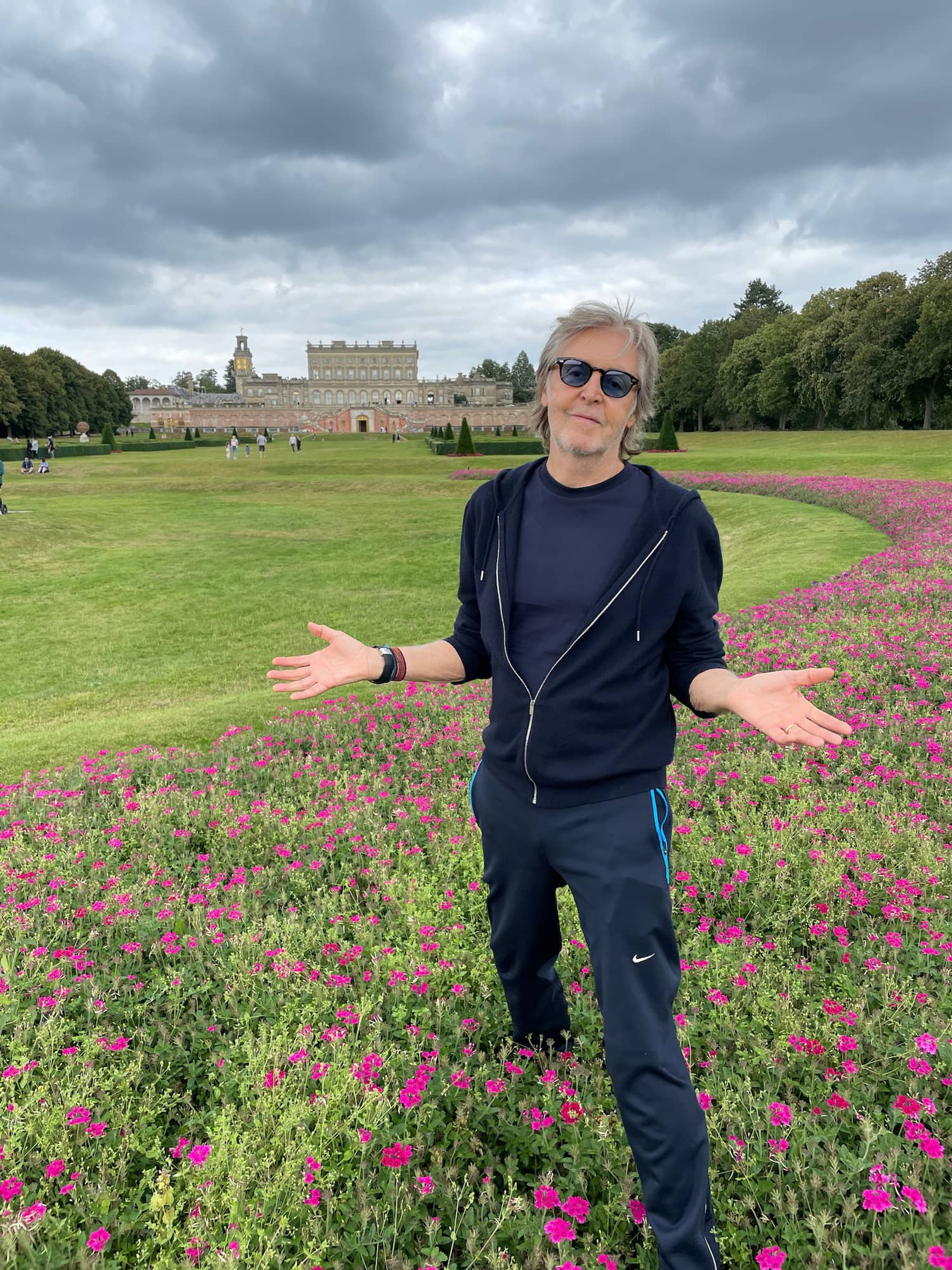 iPhone photograph of Paul McCartney posing in-front of a stately home