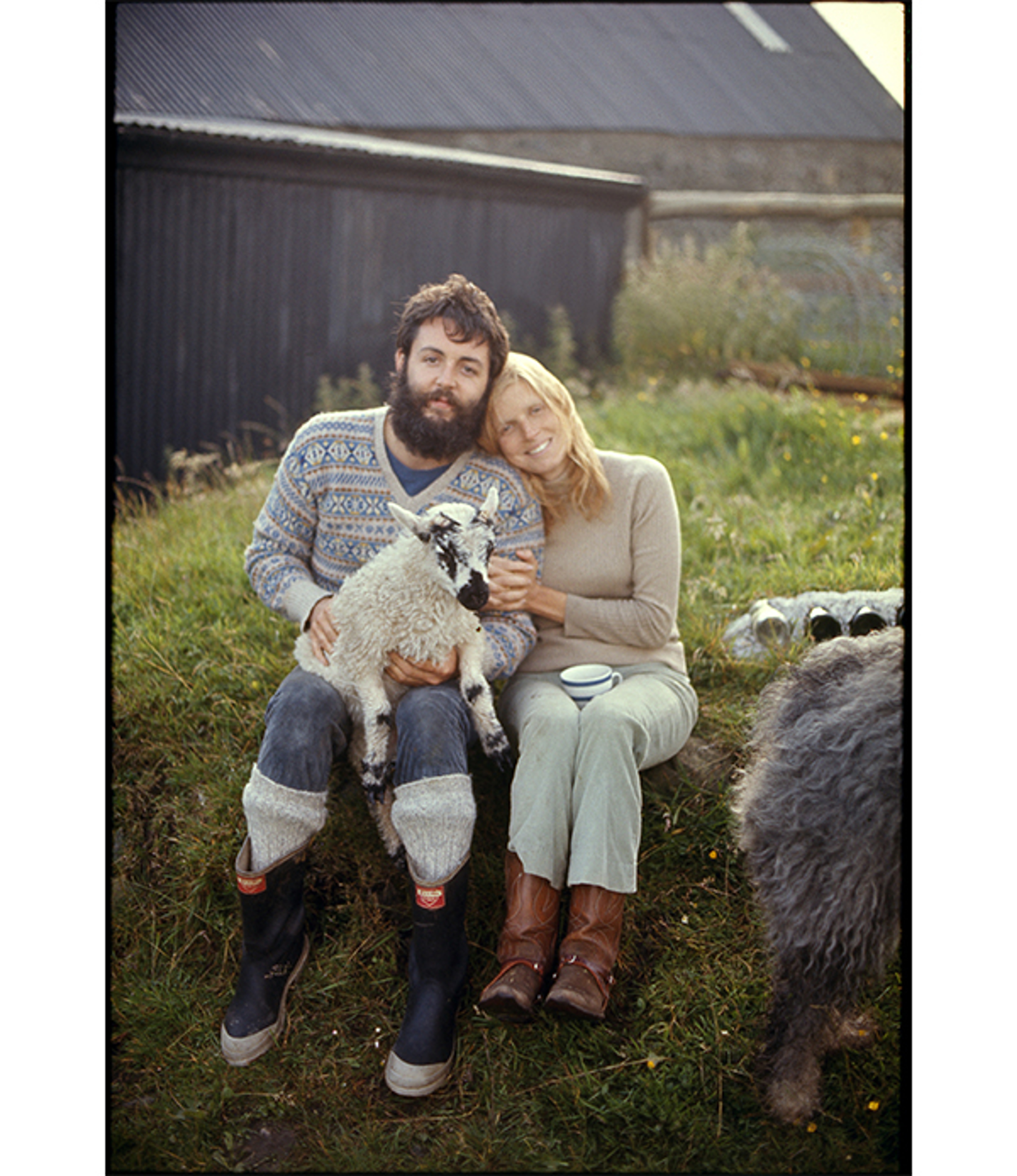 Photo of Paul and Linda McCartney holding a lamb