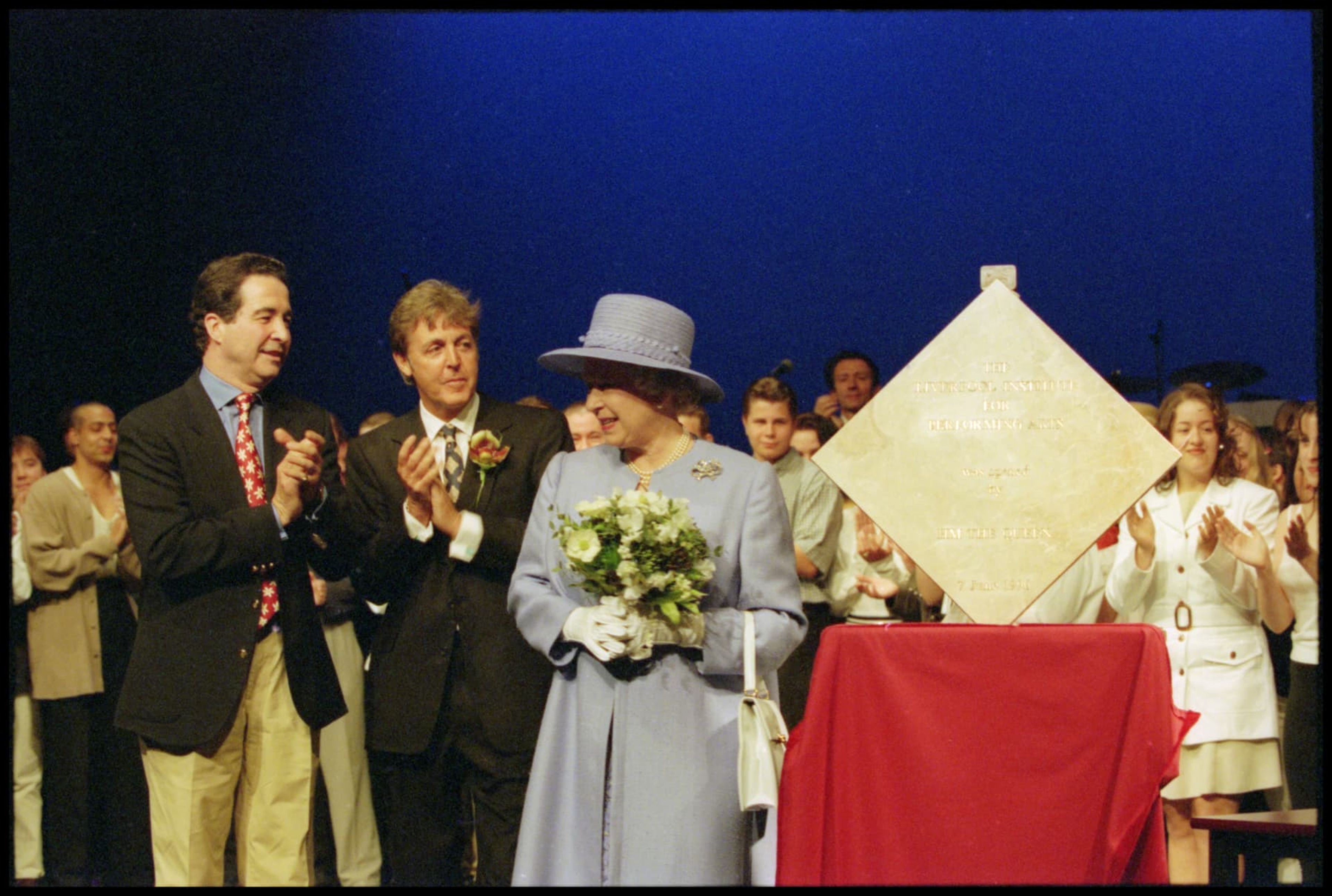 Photo of Paul and The Queen and at the royal opening of LIPA.