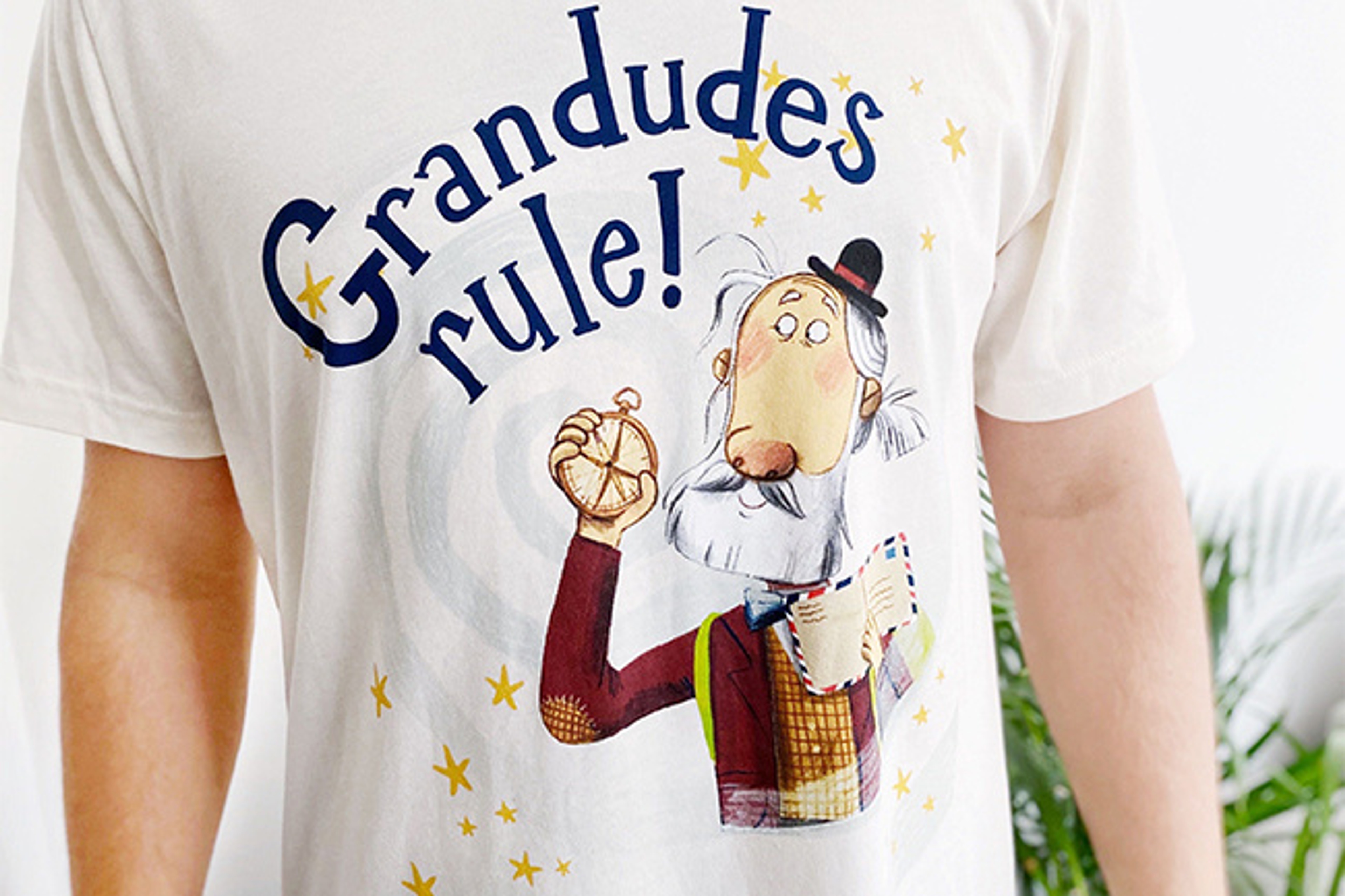 A man wearing a t shirt with a Hey Grandude! logo design