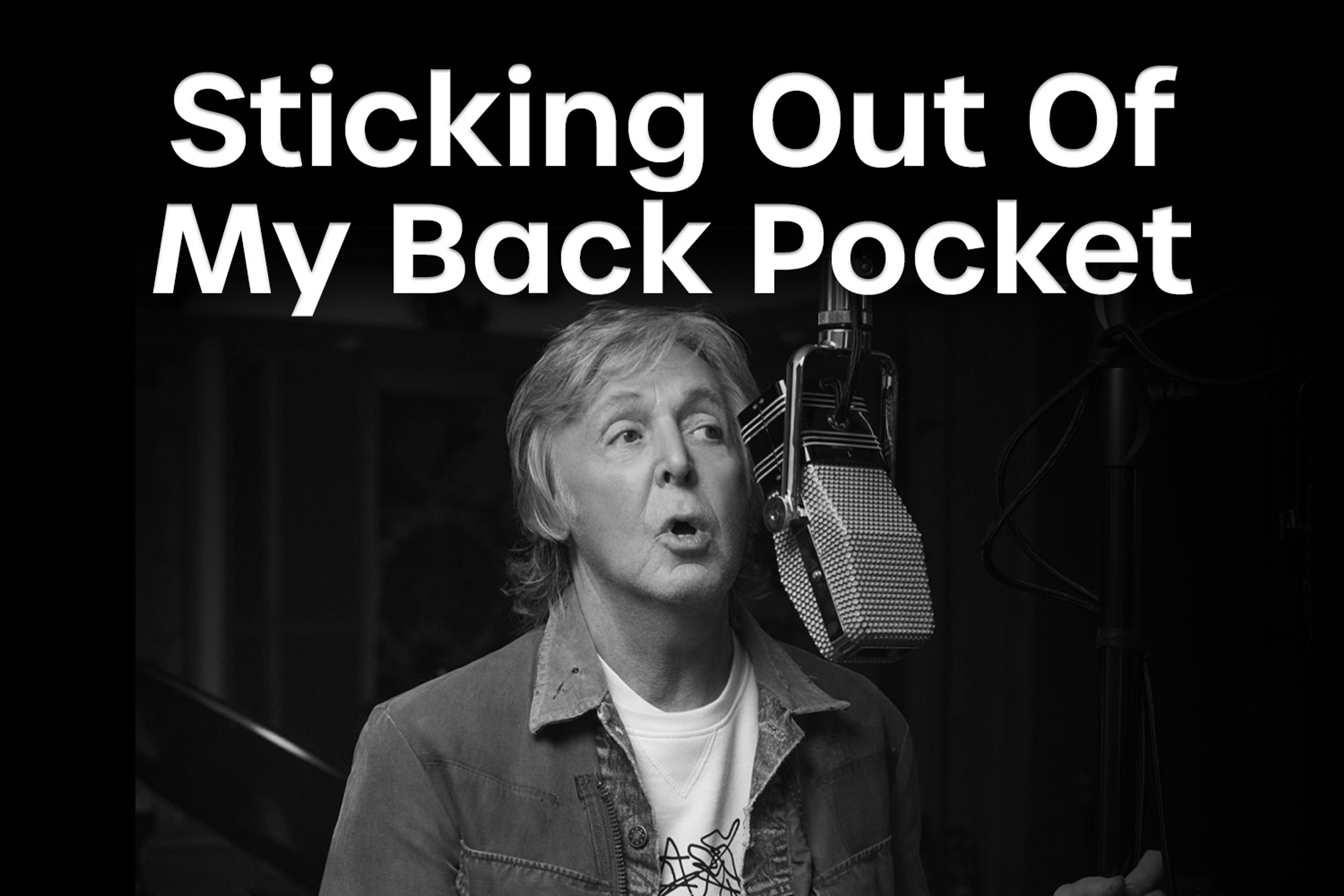 Black and white photo of Paul recording McCartney III used for July 2024's 'Sticking Out of My Back Pocket' playlist