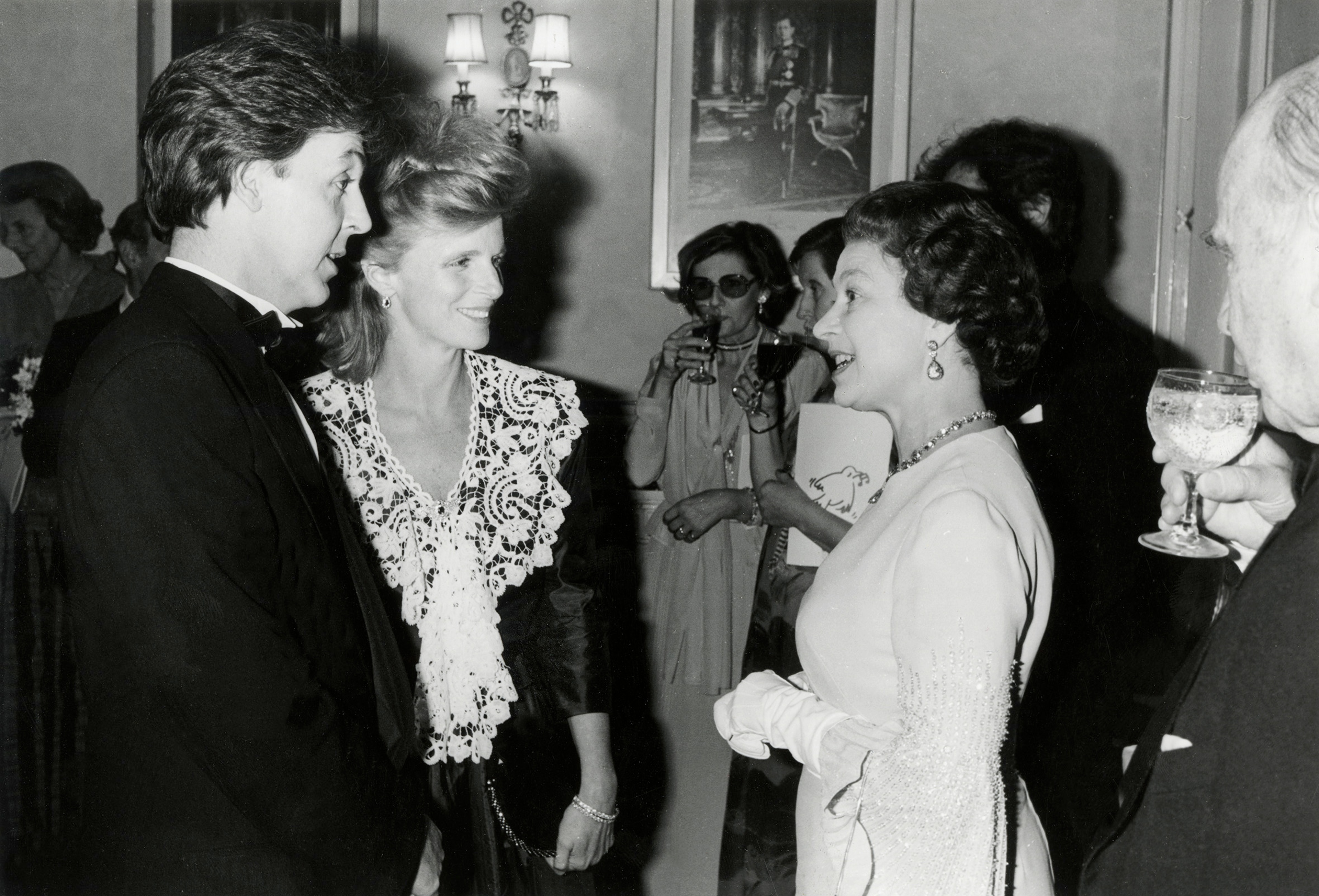 Paul and Linda with HRH Queen Elizabeth at an 'Evening for Conservation', at the Royal Albert Hall 
