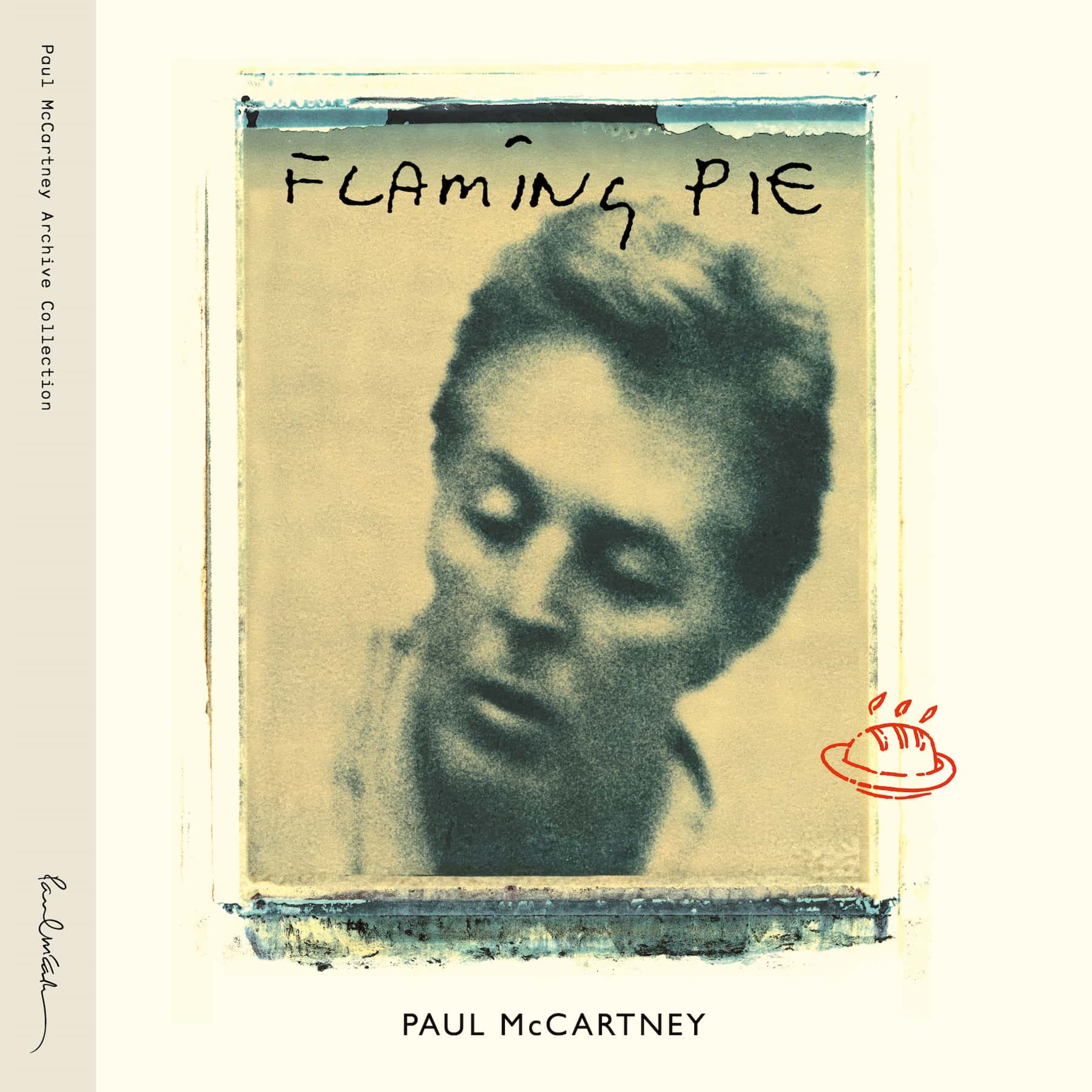 Photo of Flaming Pie (Archive Collection) album artwork which includes a polaroid transfer of Paul McCartney.