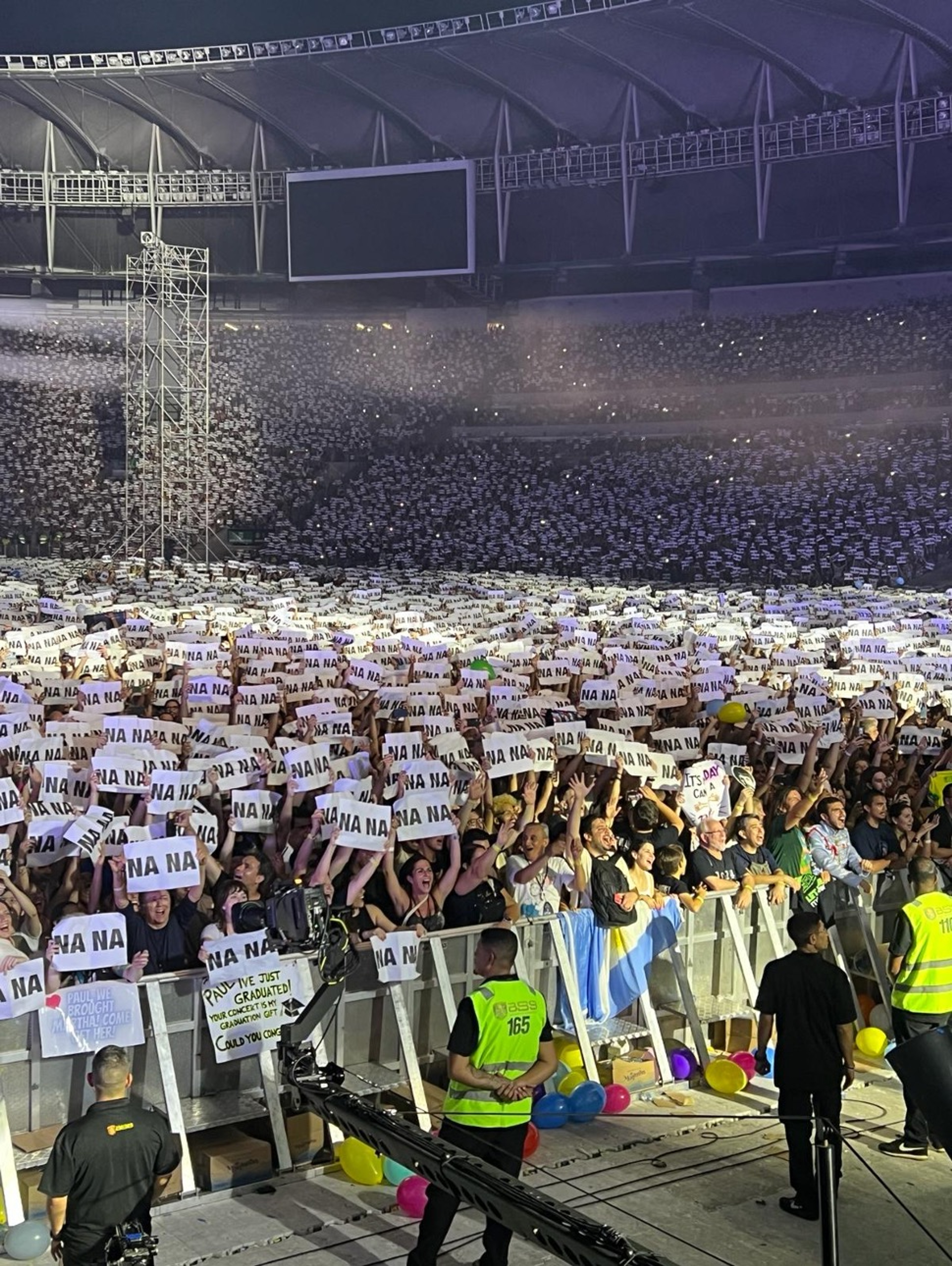 Photo of fans holding signs saying "Na Na!" in Rio de Janeiro, Brazil