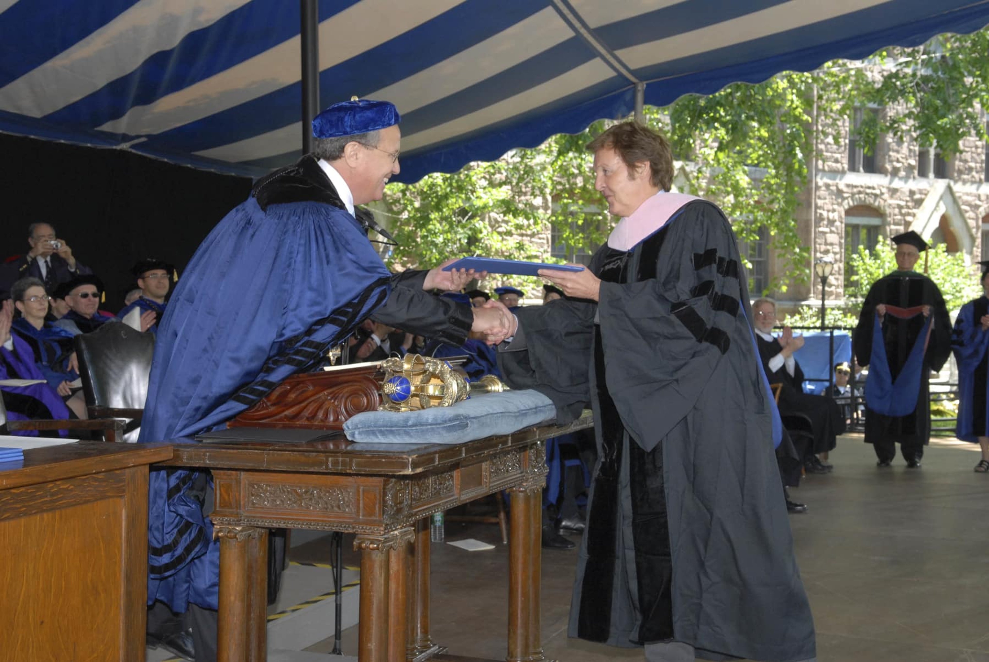 Paul wearing a Yale University gown, receiving his honorary degree