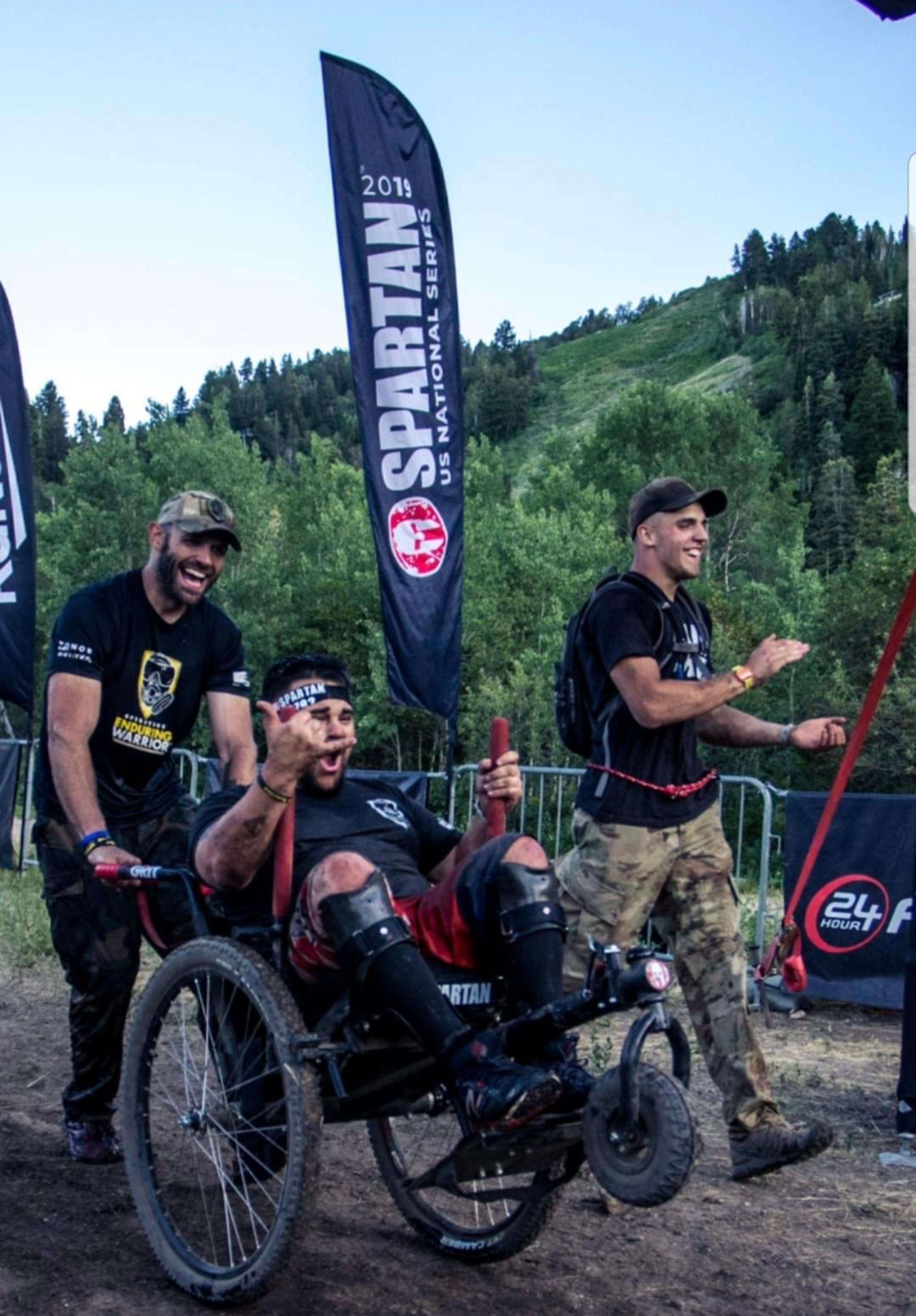 Christopher Wolff crossing the finish line at a Spartan race.