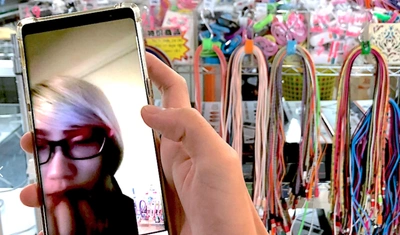 Weixin Chong navigates the mall remotely through video calls from Belgium.