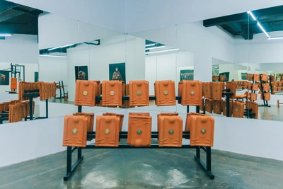 Installation view: Julian Abraham "Togar", 'Ulah Tanah', 2019, RUCI Art Space, Jakarta. In view: SUPER BADAY FITNESS CENTRE, 2019, Painted metal structure, sling, clay rooftiles, various dimensions. Photograph by Fira, Courtesy RUCI Art Space.
