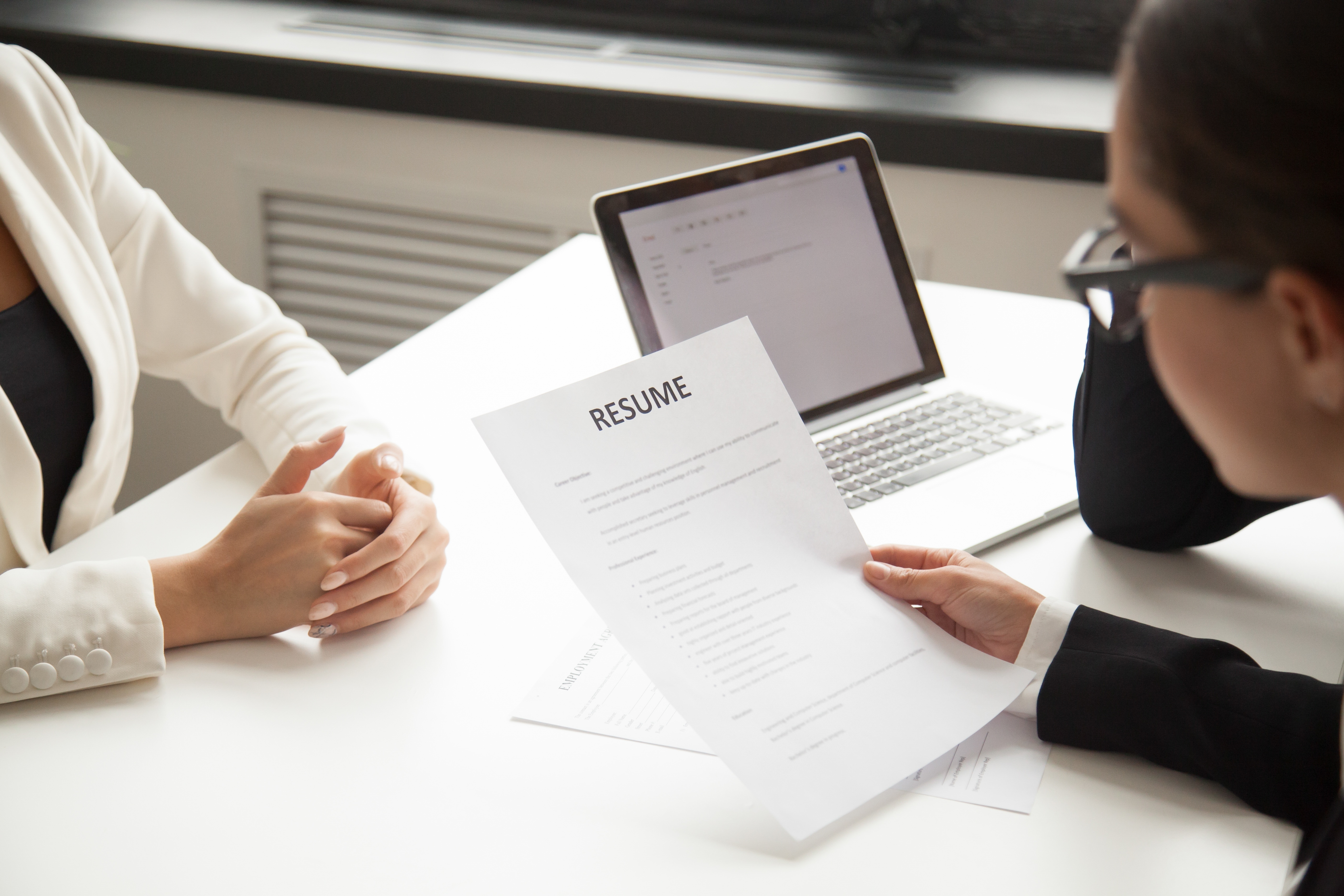 Closeup of hiring manager reading a resume