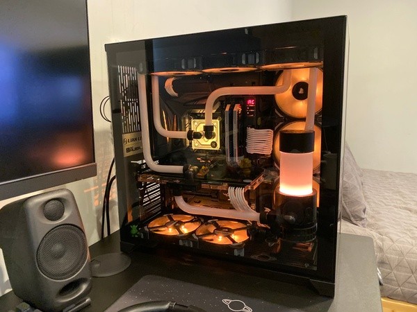 Custom EKWB loop in O11D with orange lighting