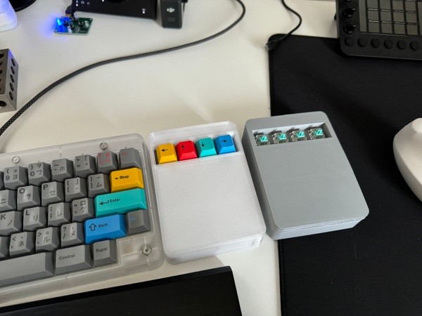 Prototype macropads next to RAMA Kara keyboard