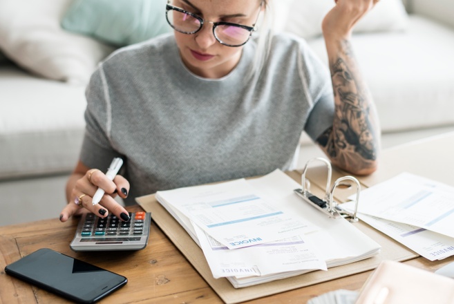 caucasian-woman-with-invoice-bills.jpg