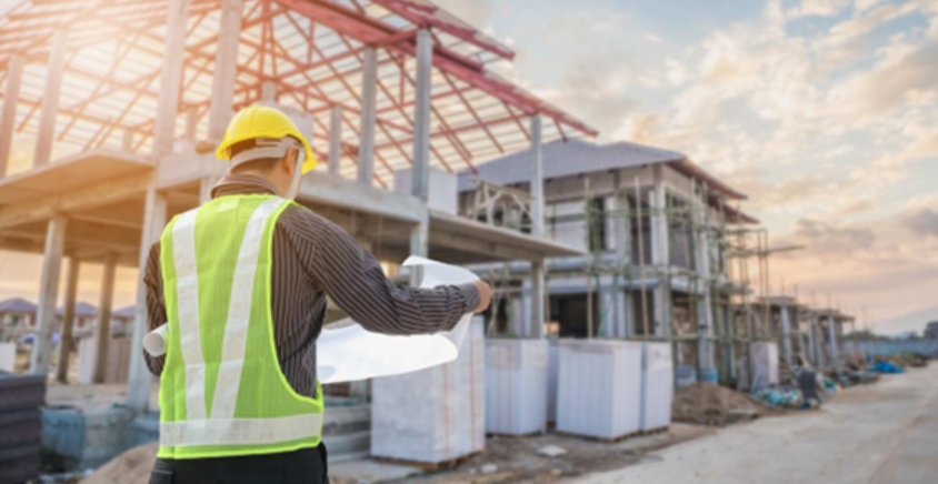 man going thru plans in detail