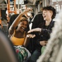 Friends laughing on bus