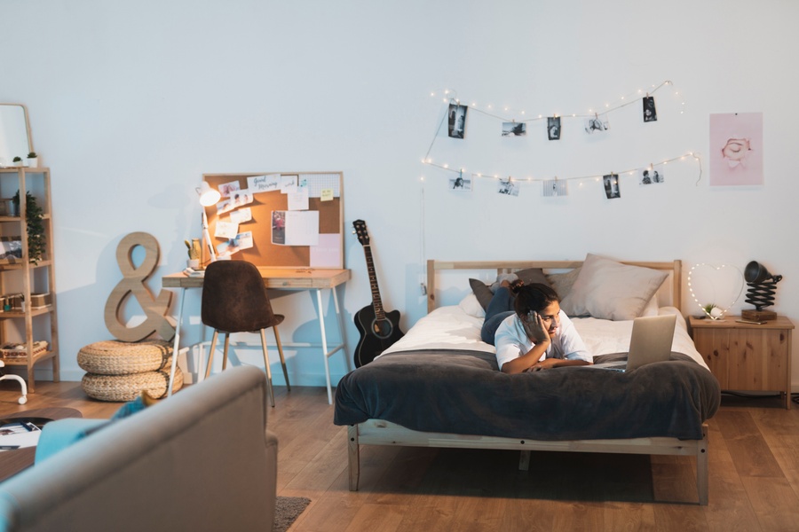 Teenager laying on her bed