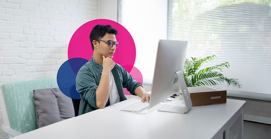 Man doing analytics on computer