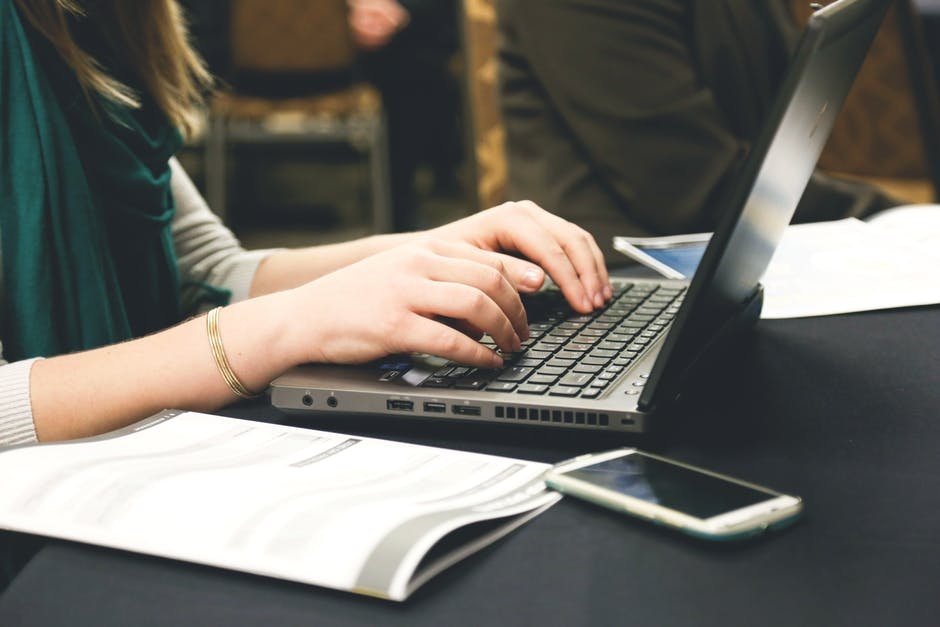 woman typing welcome message for staff