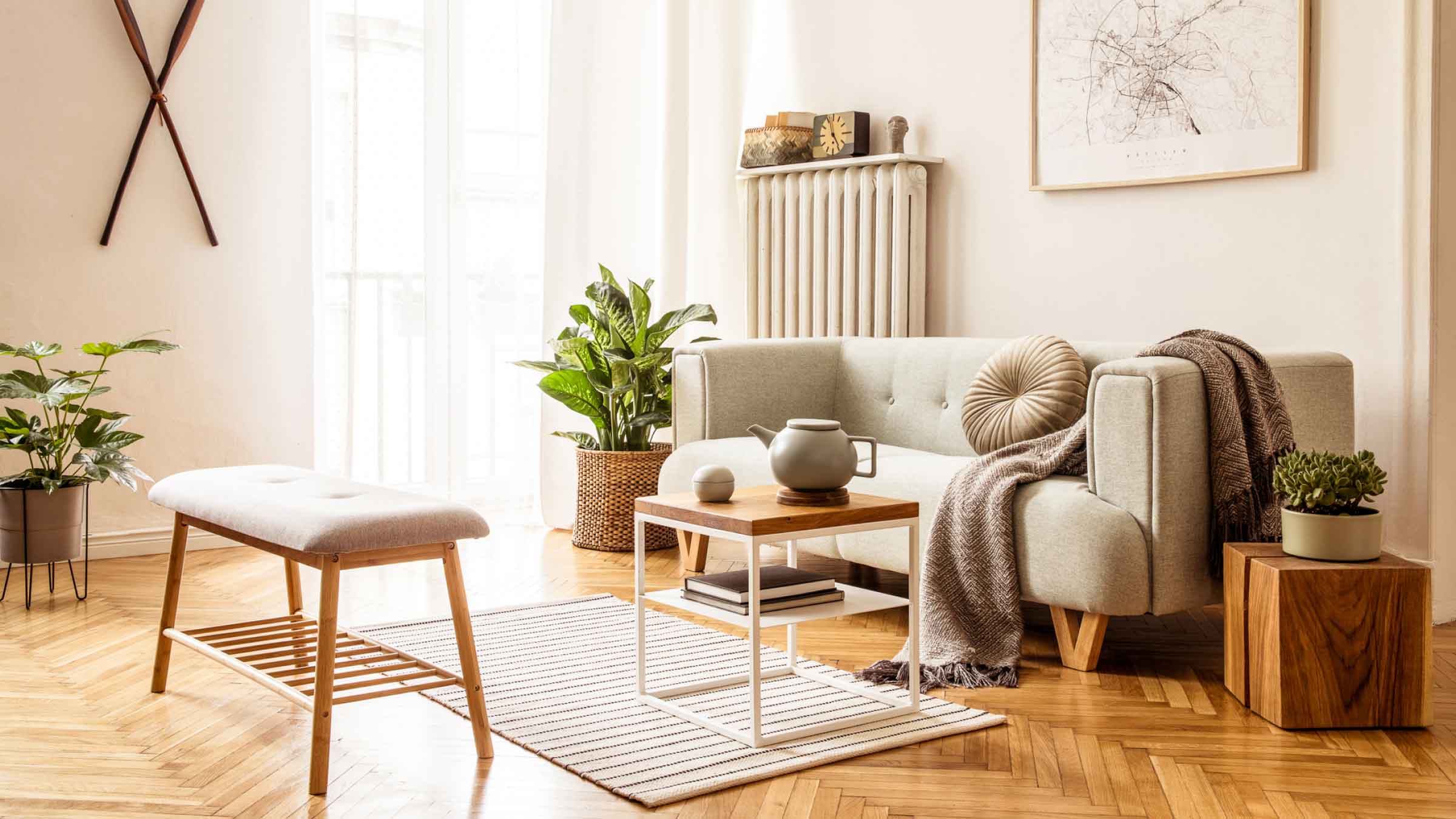 Light filled living room, with neutral soft furnishings, the feature is the oak herringbone timber floor.