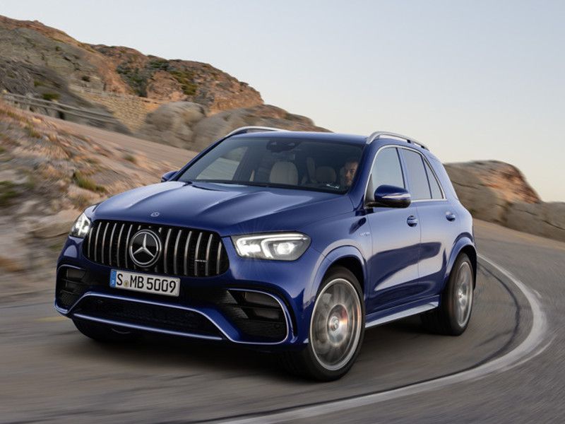 2021 Mercedes AMG GLE 63 S blue driving around curve ・  Photo by Mercedes-AMG