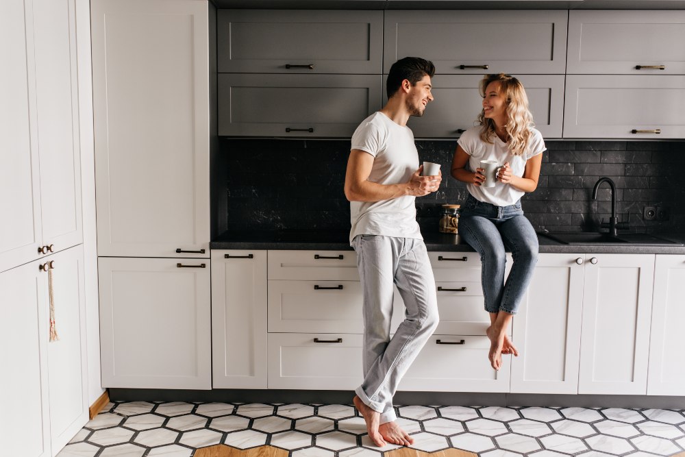 good-humoured-young-man-drinking-tea-kitchen-with-stylish-interior-indoor-portrait-carefree-couple-enjoying-breakfast (1).jpg