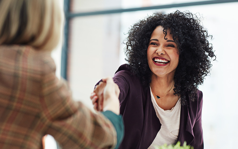 women shaking hands in business.jpg