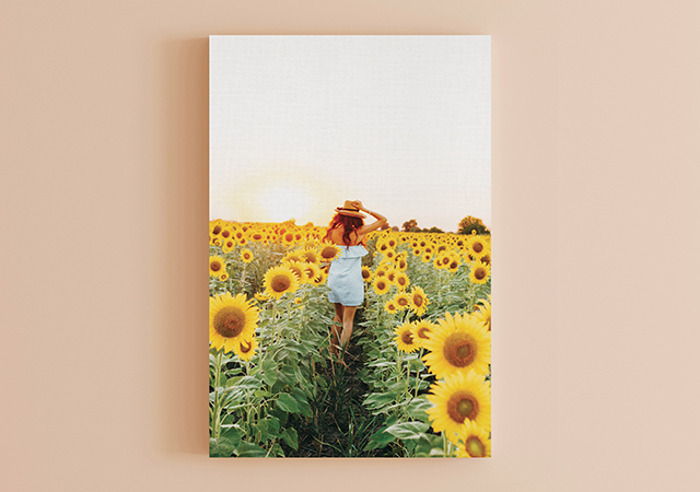 Girl running through sunflowers