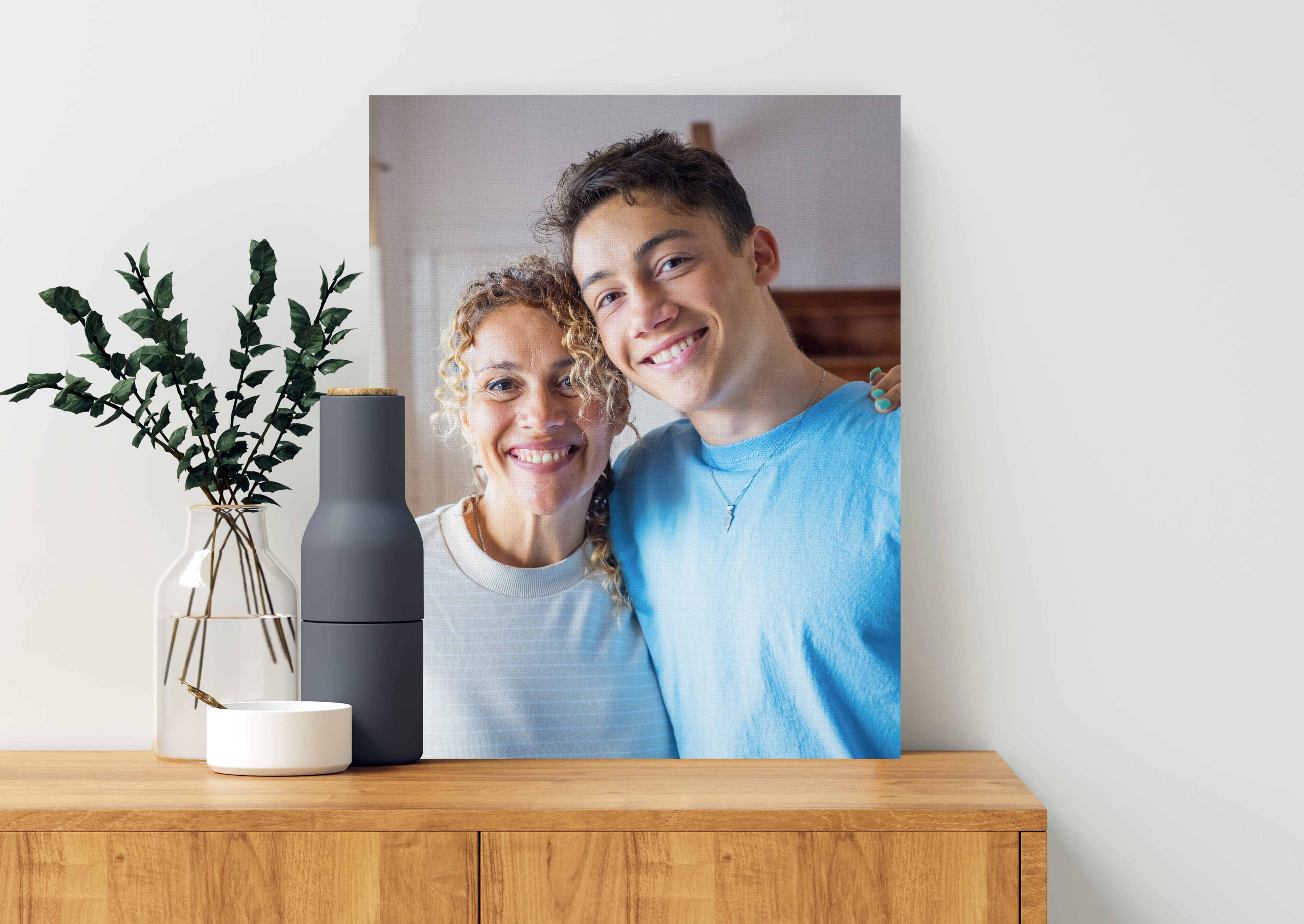 Canvas print on top of drawer of mother and son