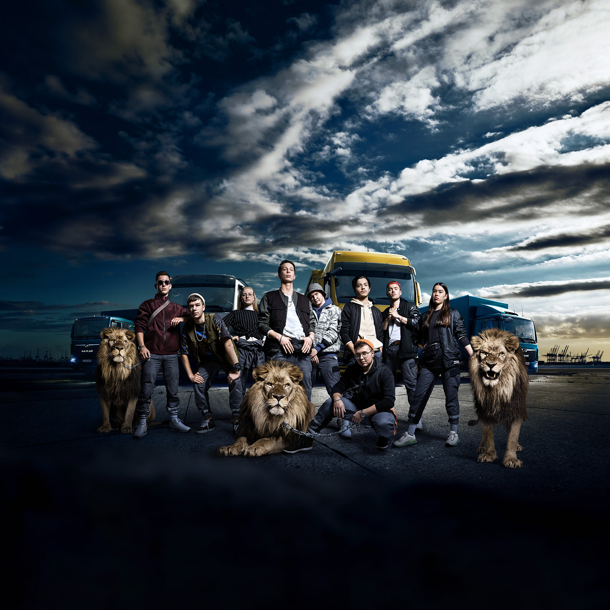 Assembled group portrait with trucks and lions