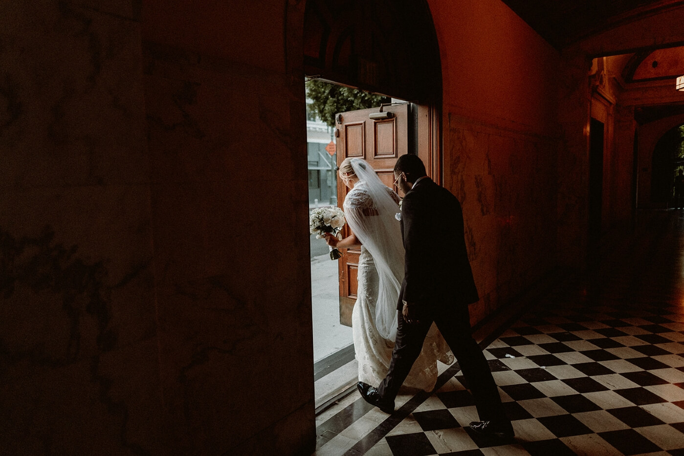 bride and groom exiting vibiana