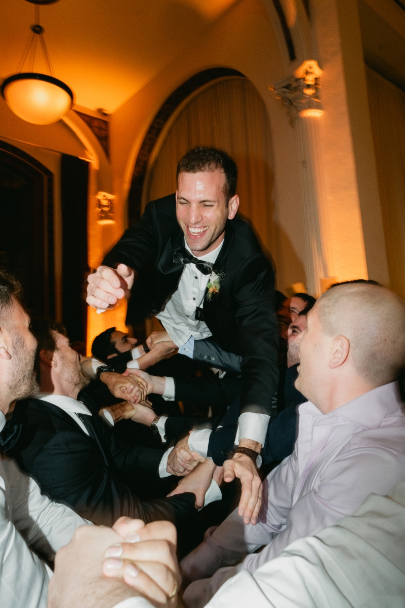 a groom crowd dives into his guests at a wedding reception in downtown Los Angeles