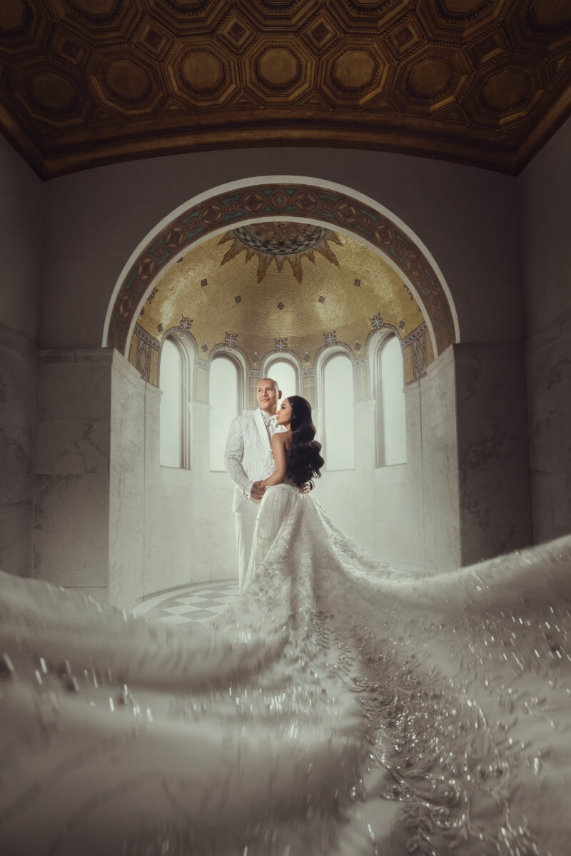 bride and groom in front of dome