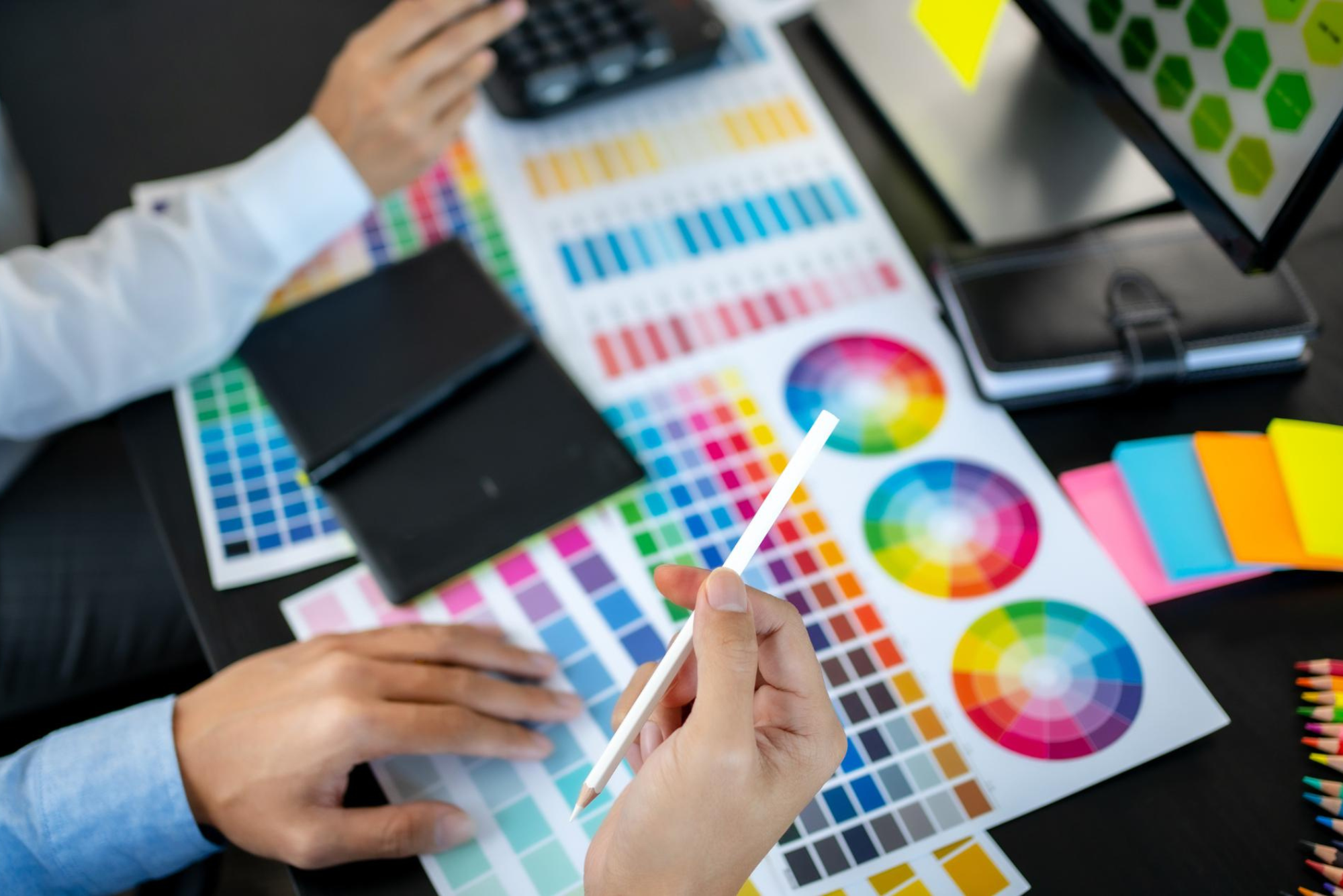 Learn the differences between CMYK and Spot Color Printing as printing methods in the world of design and branding. Discover the difference between CMYK’s four-color process and its versatility for full-color printing, contrasted with the precision and vibrancy of spot color printing. 